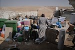 Members of the Hamamdeh family gather their belongings after Israeli authorities demolished their home in the West Bank village of Masafer Yatta Wednesday.
