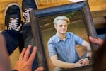 (Left to right) Jon and Jennifer Epstein, with a photo of their son Cal at their Beaverton home, May 8, 2023. Cal died in 2020 from a fentanyl overdose after unknowingly taking a pill made with illicit fentanyl. They now share Cal’s story to help spread awareness, including advocating for school districts to teach lessons about the dangers of the drug. 