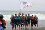 A group of youth celebrate as they pose for their photo after completing the historic descent down the newly undammed Klamath River.