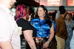 Mindy Coleman talks with invited guests at Jocktails, a charity bartending event that supports the Permanently Disabled Jockeys Fund, on April 30, 2025. Coleman works with the Jockeys’ Guild, representing professional jockeys in American Thoroughbred and Quarter Horse racing.