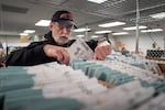 Chuck Perine processes empty ballot envelopes at the Clark County Elections Office in Vancouver, Wash. on Monday, Nov. 3, 2025.