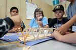 Oregon Sen. Janeen Sollman, D-Hillsboro, watches students build bridges with popsicle sticks during a summer learning program at Imlay Elementary School in Hillsboro on Wednesday, July 31, 2024.