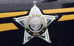 Oregon State Police emblem on a patrol car.