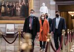 On the eve of the second impeachment trial of former President Donald Trump, Rep. Madeleine Dean, D-Pa., one of the Democratic House impeachment managers, is escorted by security through the Rotunda after preparing for the case in the Senate, at the Capitol in Washington, Monday, Feb. 8, 2021. The trial will begin Tuesday with a debate and vote on whether it's even constitutional to prosecute the former president, an argument that could resonate with Republicans keen on voting to acquit Trump.