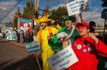 Supporters of Measure 26-201 rally outside of Walmart and U.S. Bank branches in East Portland on Oct. 9, 2018.