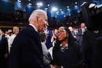 President Biden greets Supreme Court Associate Justice Ketanji Brown Jackson as he arrives to the House Chamber of the U.S. Capitol for his State of the Union address in Washington, D.C.