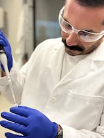 NOAA Fisheries scientist Gary Longo prepares sardine samples for extraction of DNA in the laboratory at NOAA Fisheries' Southwest Fisheries Science Center in La Jolla, California.