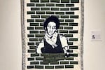 Tyler's quilt titled, "Captivity, 1974" (2023) is based on a photo his brother took of him at the St. Charles Parish jail, one month after he was arrested and charged with the murder of a white 13-year-old. He was still wearing the clothing he was arrested in.