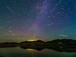 The Perseid meteor shower is seen over the Ulanbum grassland in Chifeng city, Inner Mongolia, China, on Aug. 14, 2023.