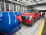 Ford F-150 Lightning pickup trucks are shown at the Ford Rouge Electric Vehicle Center in Dearborn, Michigan, on April 26, 2022. The Lightning should still qualify for the full $7,500 tax credit, but it also depends on other criteria including the sticker price of the vehicle and the buyer's income.