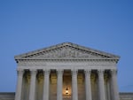 Light illuminates part of the Supreme Court building at dusk on Capitol Hill in Washington, D.C., on Nov. 16, 2022.