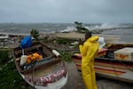 A man watches the coastline in Kingston, Jamaica, as Hurricane Melissa closes in, Tuesday, Oct. 28, 2025.
