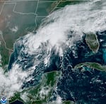 This GOES-16 GeoColor satellite image taken Saturday, Sept. 19, 2020, and provided by NOAA, shows Tropical Storm Beta, center,  in the Gulf of Mexico.  A hurricane watch is in effect Saturday for coastal Texas as Tropical Storm Beta gains strength.