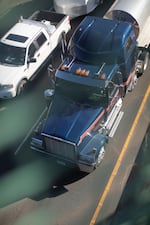 Trucks travel down Interstate 5 through the Rose Quarter in Portland, Ore., Wednesday, Oct. 30, 2019. Students at Harriet Tubman Middle School, which sits adjacent to the interstate, complain of freeway noise and the smell of emissions.