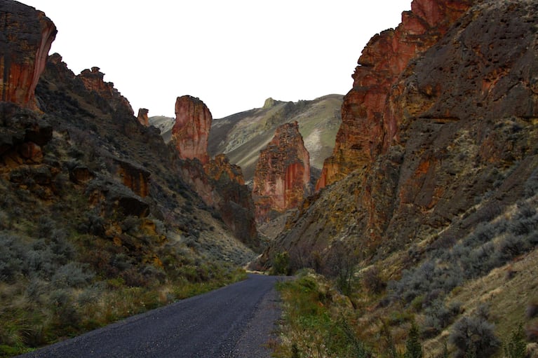 Leslie Gulch in Southeastern Oregon features sheer rock walls and red rock formations.
