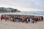Swimmers gather for a morning vigil in Sydney, Wednesday, Dec. 17, 2025, following Sunday's shooting at Bondi Beach.