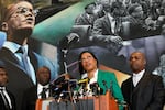 Ilyasah Shabazz (C), daughter of African-American activist Malcolm X, speaks alongside civil rights attorney Ben Crump (L) and co-counsel Ray Hamlin (R) during a press conference in New York on February 21, at the Malcolm X & Dr. Betty Shabazz Memorial and Educational Center, formerly known as the Audubon Ballroom, where Malcolm X was shot dead at 39 on Feb. 21, 1965.