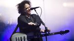 Robert Smith of The Cure performs in Glastonbury, England, in 2019. This week, he shared his frustrations with Ticketmaster, and announced Thursday that the company would lower fees and offer partial refunds to The Cure's ticket purchasers.