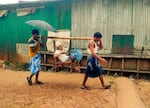 A makeshift "ambulance" carries an elderly man to a clinic run by a charity. Camp residents say they are in urgent need of emergency response vehicles and medical equipment.