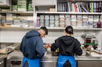 Staff prepare apples in Evett's kitchen.