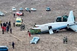 The wreckage of Azerbaijan Airlines Embraer 190 lays on the ground near the airport of Aktau, Kazakhstan, on Wednesday.