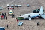 The wreckage of Azerbaijan Airlines Embraer 190 lays on the ground near the airport of Aktau, Kazakhstan, on Wednesday.