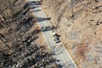 Crews work to clear loose rock from the side of Highway 126 in Oregon Sept. 28, 2020.