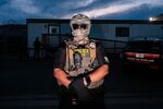 ICE agents stand guard outside a immigrant detention center in Newark, New Jersey in May 2026. Medicaid officials improperly shared data about millions of people with ICE, who then shared that data with the data analytics firm Palantir, according to new court filings.