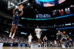 FILE - UConn forward Tarris Reed Jr. (5) dunks against Duke during the second half in the Elite Eight of the NCAA college basketball tournament on March 29, 2026, in Washington.