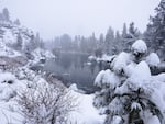A view of the Deschutes River near First Street rapids in Bend, after a winter storm dumped over a foot of snow overnight on February 25, 2019.  