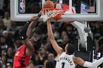 Portland Trail Blazers center/forward Robert Williams III (35) scores past San Antonio Spurs forward/center Victor Wembanyama (1) during the second half in Game 5 of a first-round NBA playoffs basketball series in San Antonio, Tuesday, April 28, 2026.