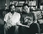 Bob Shimabukuro, right, reads with his brother, Sam, circa 1988. Sam Shimabukuro died of AIDS the same year.