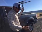 Andrew Shields, a wildlife biologist for Roaring Springs Ranch in southeastern Oregon, searches for a radio collared sage grouse.