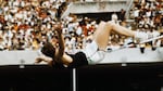 Dick Fosbury set an Olympic record as he cleared the bar in the high jump event at 7 feet, 4 1/4 inches in the 1968 Olympics in Mexico.