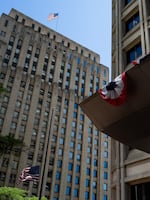 A flag flies above the Henry M. Jackson Federal Building in Seattle, Wash.