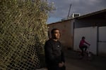 Mohammad Abu Queider stands near his home in al-Zarnuq, an unrecognized Bedouin village in southern Israel. His family has been caught in the crossfire twice: first during the Hamas attack and then in the Iranian strike.