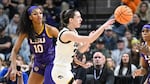 LSU's Angel Reese, left, and Iowa guard Caitlin Clark, center, called their Elite Eight game a great event for their sport. Millions of viewers agreed, launching the contest to the top of ESPN's ratings.