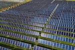 FILE - Solar panels operate, April 28, 2026, at a farm in Christiana, Tenn.