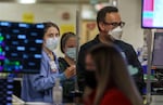 FILE: Nurse Ali Strawn, left, evaluates patients coming via ambulance to the Salem Health Emergency department in Salem, Ore., Jan. 27, 2022.