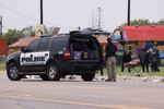 Emergency personnel respond to a fatal collision in Brownsville, Texas, on Sunday. Several people were killed after they were struck by a vehicle while waiting at a bus stop near Ozanam Center, a migrant and homeless shelter.