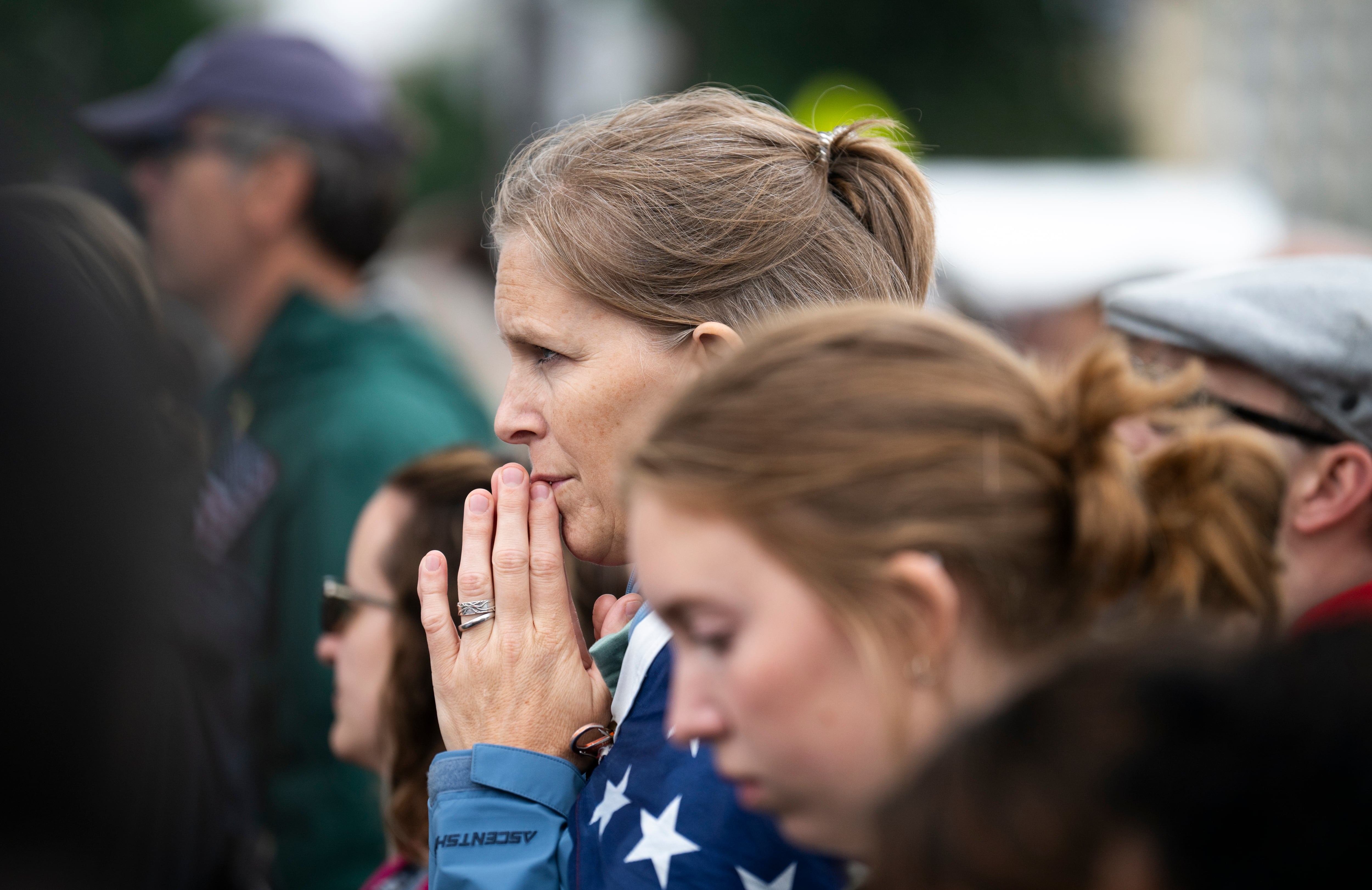 St. Paul: A demonstrator looks on as a speaker addresses the crowd during a