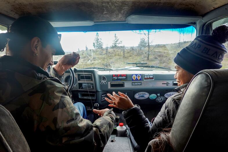 Elke Littleleaf and Klick'ump, or Alysia Aguilar, untangle fishing line and inspect a lure Littleleaf made, as they tour the Warm Springs Reservation in their truck, "Silversquatch," Feb. 2, 2024.