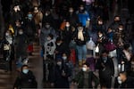 Travelers walk along a concourse at Beijing West Railway Station in Beijing, Wednesday, Jan. 18, 2023. A population that has crested and is slowly shrinking will pose new challenges for China's leaders, ranging from encouraging young people to start families, to persuading seniors to stay in the workforce longer and parents to allow their children to join the military.