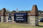 Law enforcement arrive as students are evacuated to the football stadium after the school campus was placed on lockdown at Apalachee High School in Winder, Ga., on Wednesday, Sept. 4, 2024.