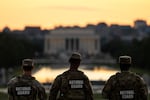 Members of the National Guard are seen standing near the Washington Monument, on September 2 in Washington, DC. National Guard troops and federal law enforcement continue to patrol the nationa's capital weeks after President Donald Trump ordered them to assist in crime prevention.