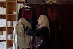 Palestinian Hanan Zarura shows the embroidery on a jacket at Beit Atfal Assumoud, a nonprofit organization in the Palestinian refugee camp of Shatila, in Beirut, Lebanon, on Dec. 2, 2024.