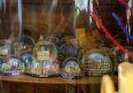 Snow globe souvenirs, collected by June Knightly and her wife, Kat Knapp, and displayed at their Portland home, April 7, 2023. Knightly was one of four people shot by Benjamin Smith at Normandale Park in Northeast Portland on Feb. 19, 2022. 