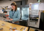 Keenan Spencer, pictured in Pendleton at an April 2026 symposium, operates a computerized lathe for for Sigma Designs.