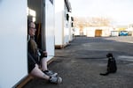 Sharleyin Corbett sits at her home as part of the new Safe Stay community at 415 West 11th Street, Vancouver, Wash., on Nov. 21, 2023. The city of Vancouver opened the village several days ago.