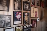 Malafouris's living room wall is covered with photos of famous people he says he has met or worked with. Not only was he in the furniture business, Malafouris was also in show business.